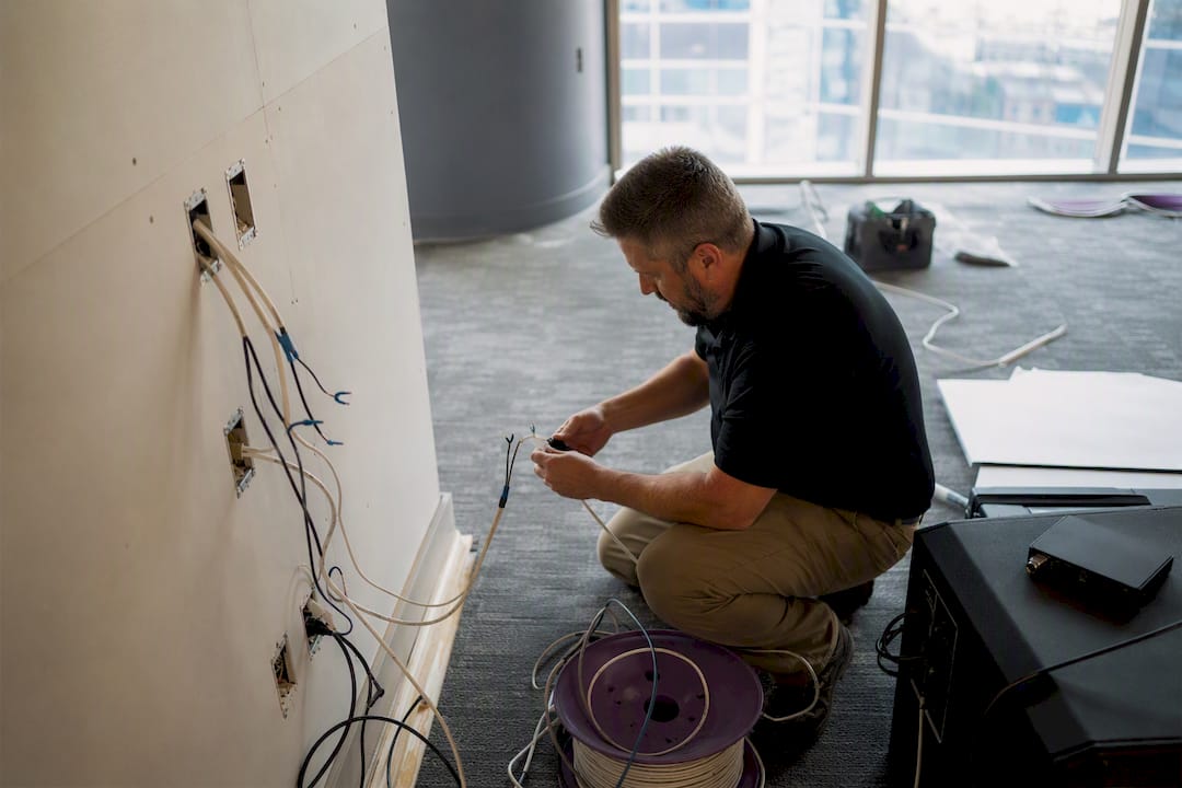 Technician conducting technology dry run in office