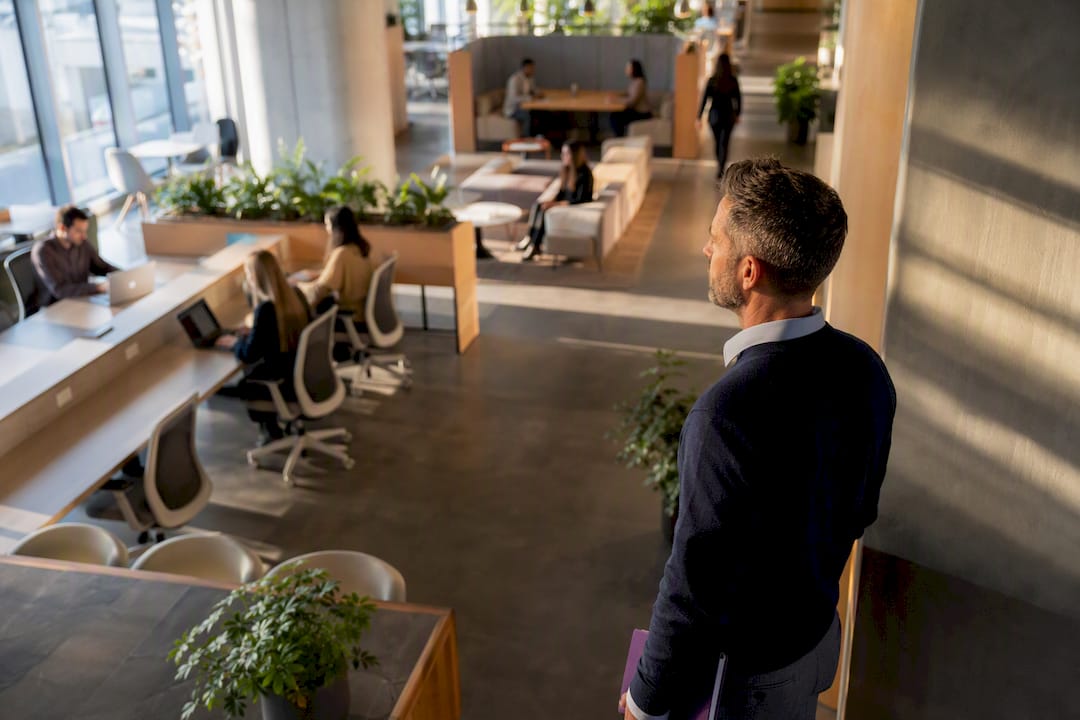 Facilities practitioner assessing an occupied workplace