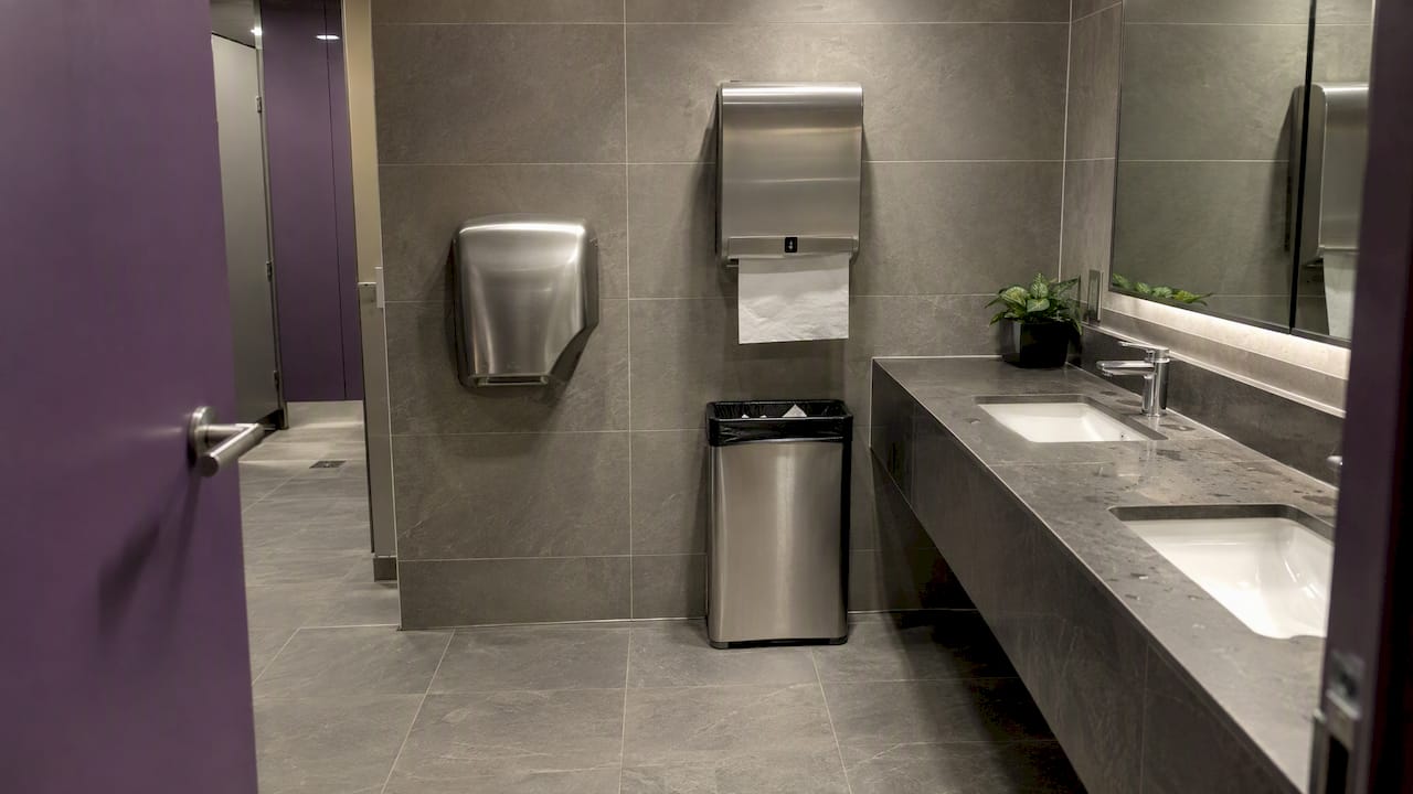 Office washroom with dryer and towel dispenser